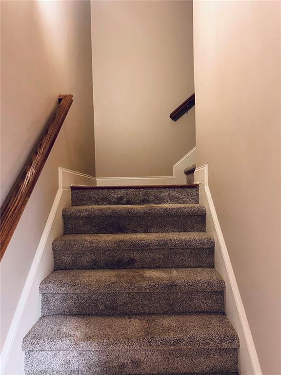 144 West Ridge Way Roswell, GA 30076 - Photo 14 of 30 a view of staircase with white walls