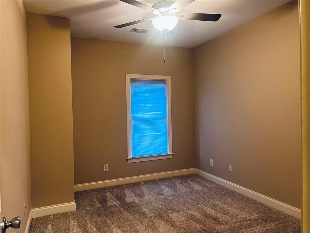 144 West Ridge Way Roswell, GA 30076 - Photo 16 of 30 an empty room with windows and fan