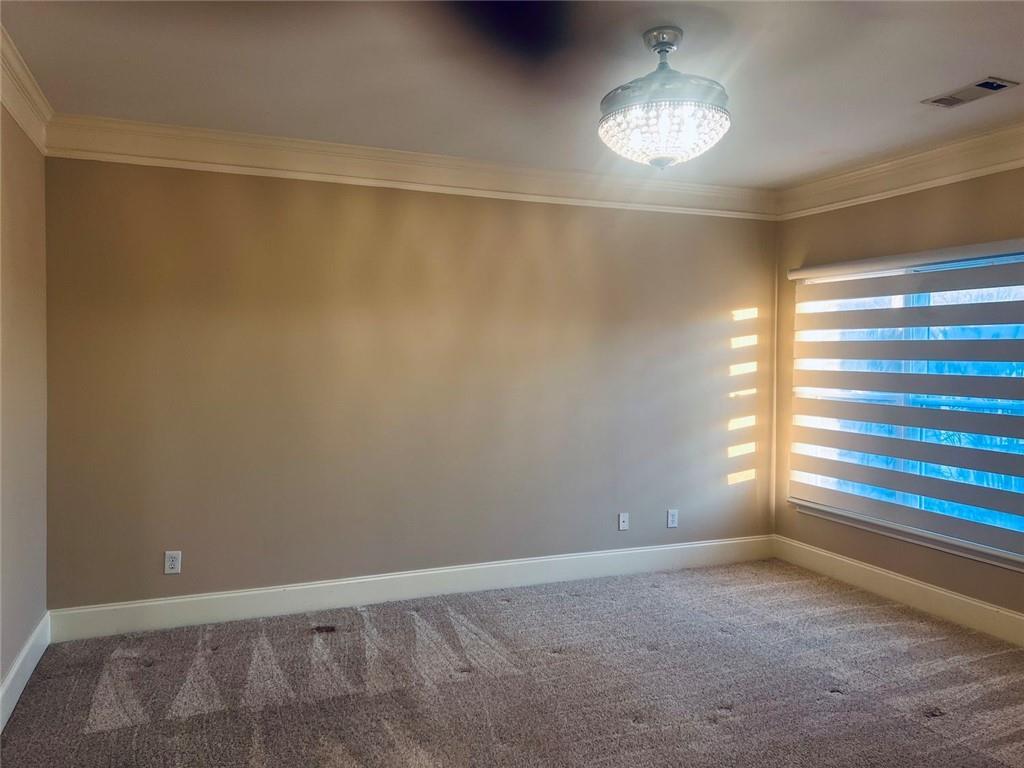144 West Ridge Way Roswell, GA 30076 - Photo 21 of 30 a view of an empty room with window and chandelier fan