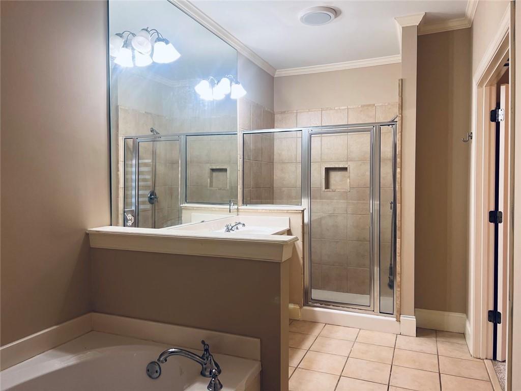 144 West Ridge Way Roswell, GA 30076 - Photo 23 of 30 a bathroom with a sink a mirror and a shower