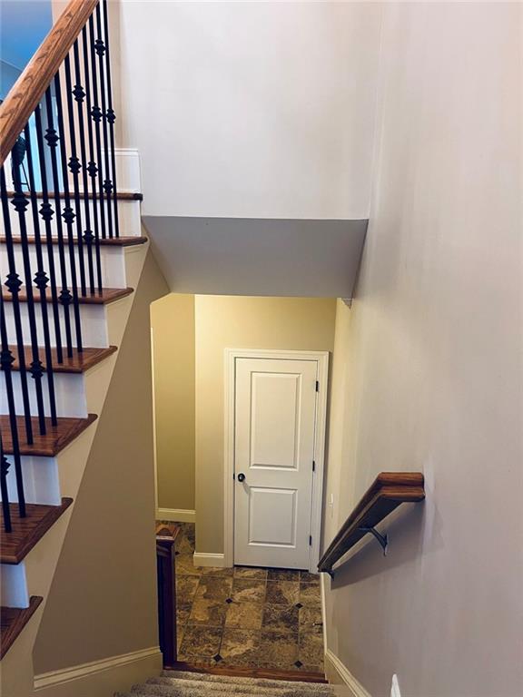 144 West Ridge Way Roswell, GA 30076 - Photo 26 of 30 a view of a hallway with wooden floor and staircase