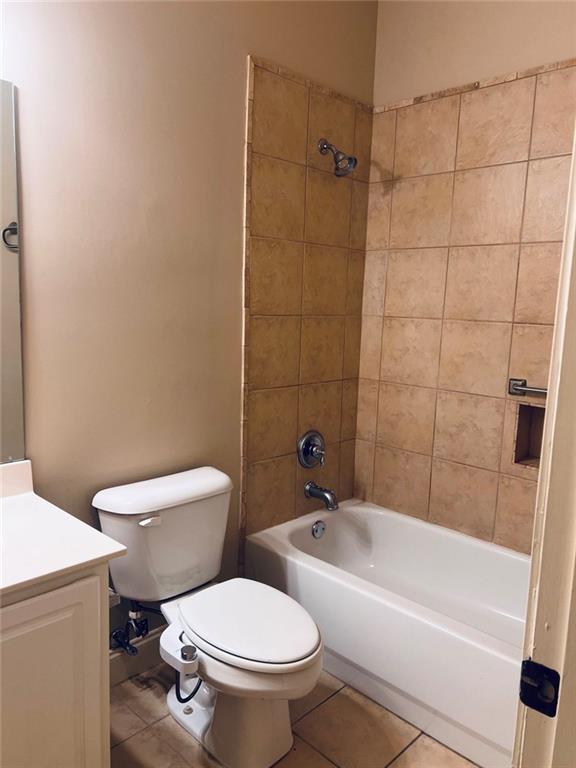 144 West Ridge Way Roswell, GA 30076 - Photo 27 of 30 a white toilet and tub sitting next to a bathroom sink