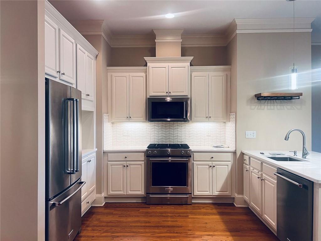 144 West Ridge Way Roswell, GA 30076 - Photo 5 of 30 a kitchen with stainless steel appliances granite countertop a refrigerator stove and sink