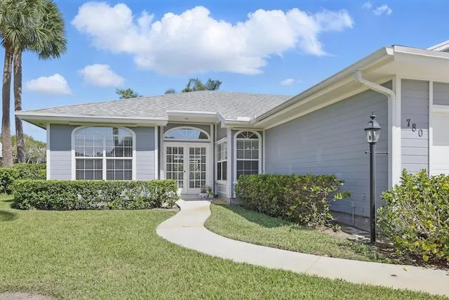 front view of a house with a yard