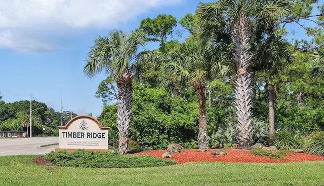 a view of front of house with yard and green space