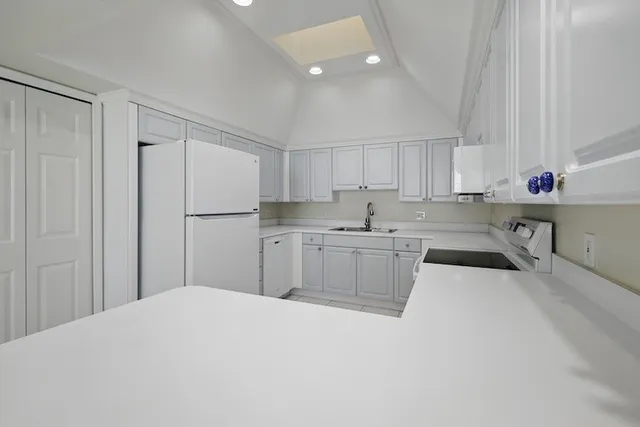 a kitchen with a white cabinets