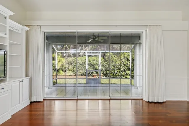 a view of a large window with wooden floor