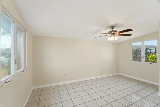 a kitchen with granite countertop white cabinets white stainless steel appliances and a sink