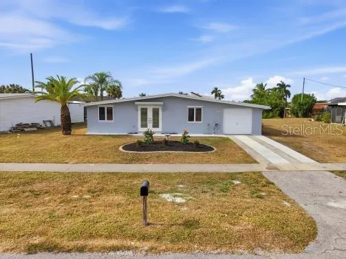 a house with a swimming pool in front of it