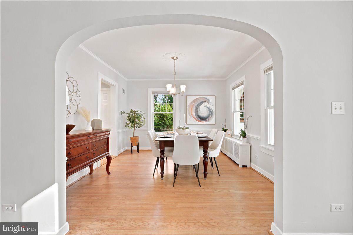 2800 South Arlington Ridge Road Arlington, VA 22206 - Photo 12 of 54 a living room with furniture a window and a dining table