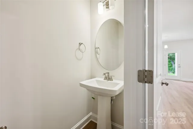 a bathroom with a sink and mirror
