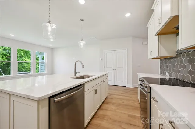 a kitchen with a sink and a window