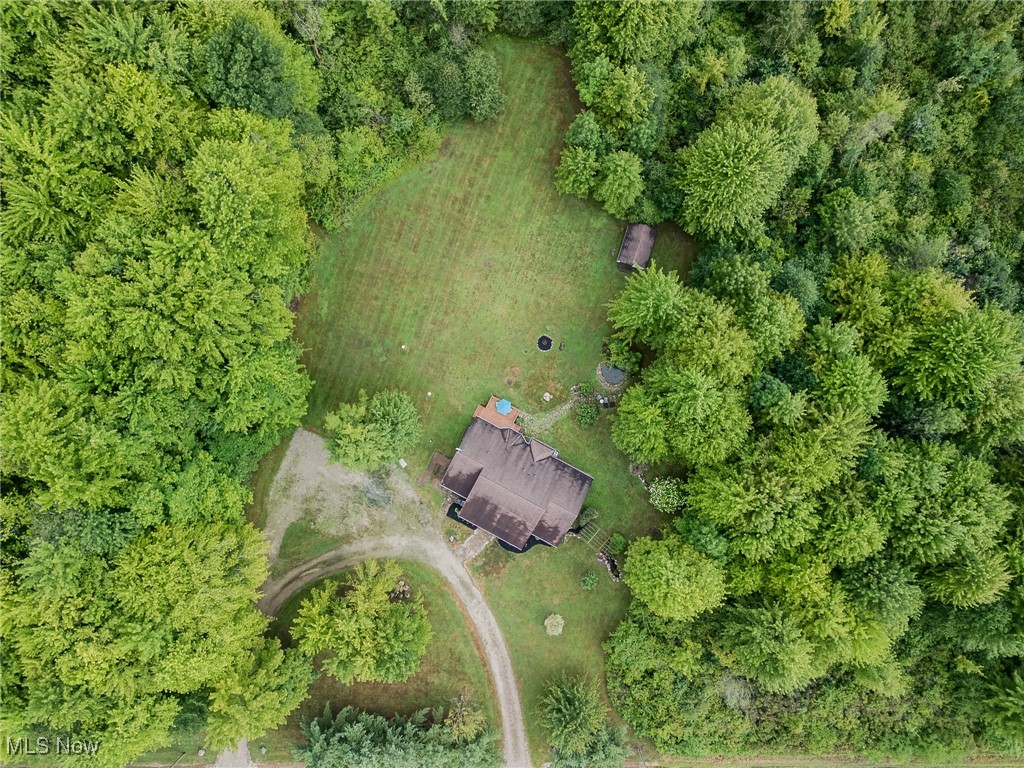 5691 Callahan Road Rome, OH 44085 - Photo 10 of 45 Aerial view of property and surrounding area featuring a forest