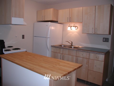 412 Mill Avenue South Renton, WA 98057 - Photo 11 of 13 a kitchen with a sink and cabinets