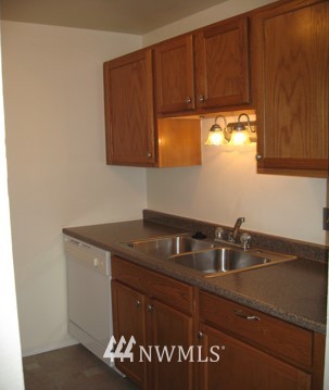 412 Mill Avenue South Renton, WA 98057 - Photo 12 of 13 a kitchen with a sink and cabinets
