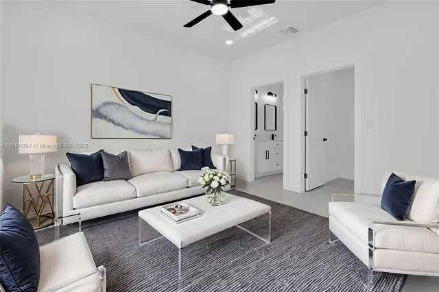 a living room with furniture and a rug