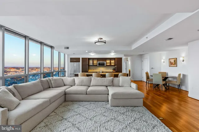 a living room with furniture and a large window