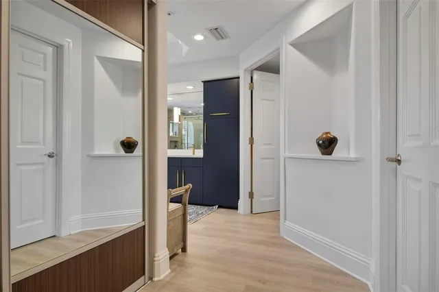 a view of a lake with a table and chairs
