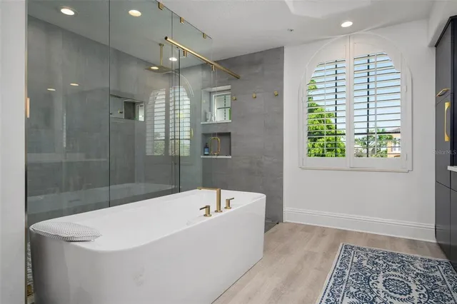 a balcony with furniture and a potted plant