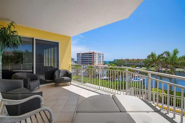a swimming pool with outdoor seating and city view