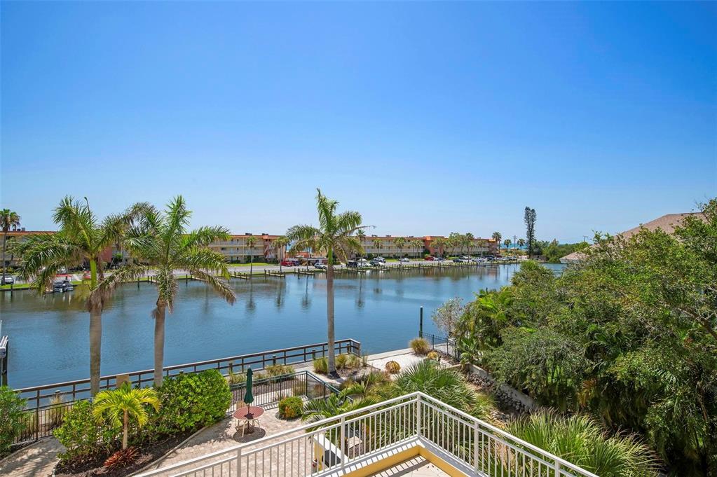 9122 Midnight Pass Road, Unit 34 Sarasota, FL 34242 - Photo 42 of 61 a view of a lake from a balcony