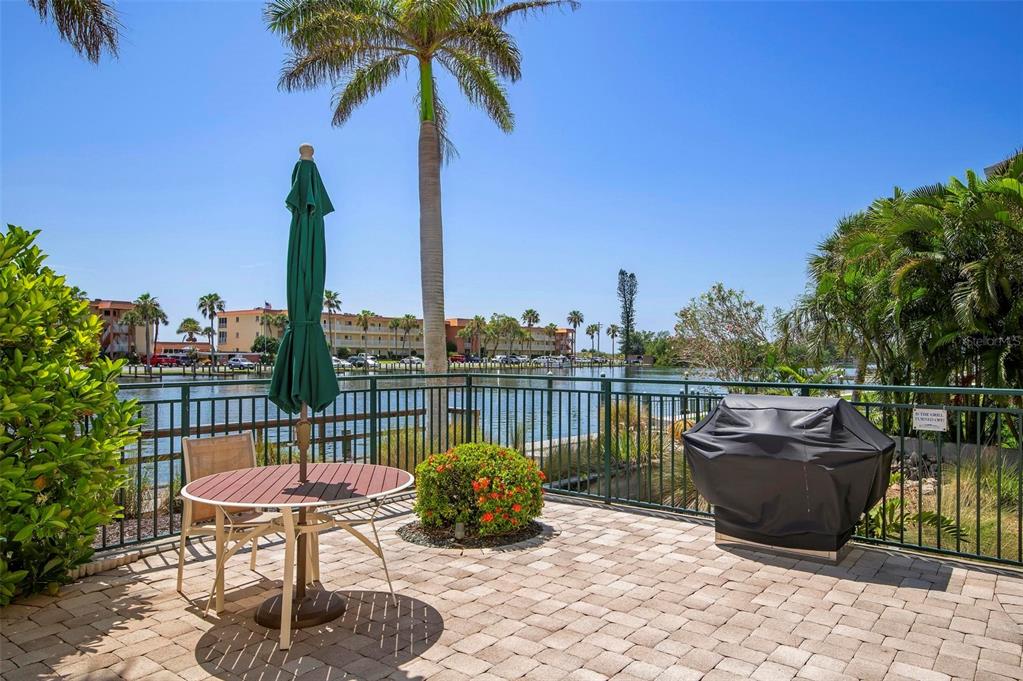 9122 Midnight Pass Road, Unit 34 Sarasota, FL 34242 - Photo 43 of 61 a view of a terrace with furniture