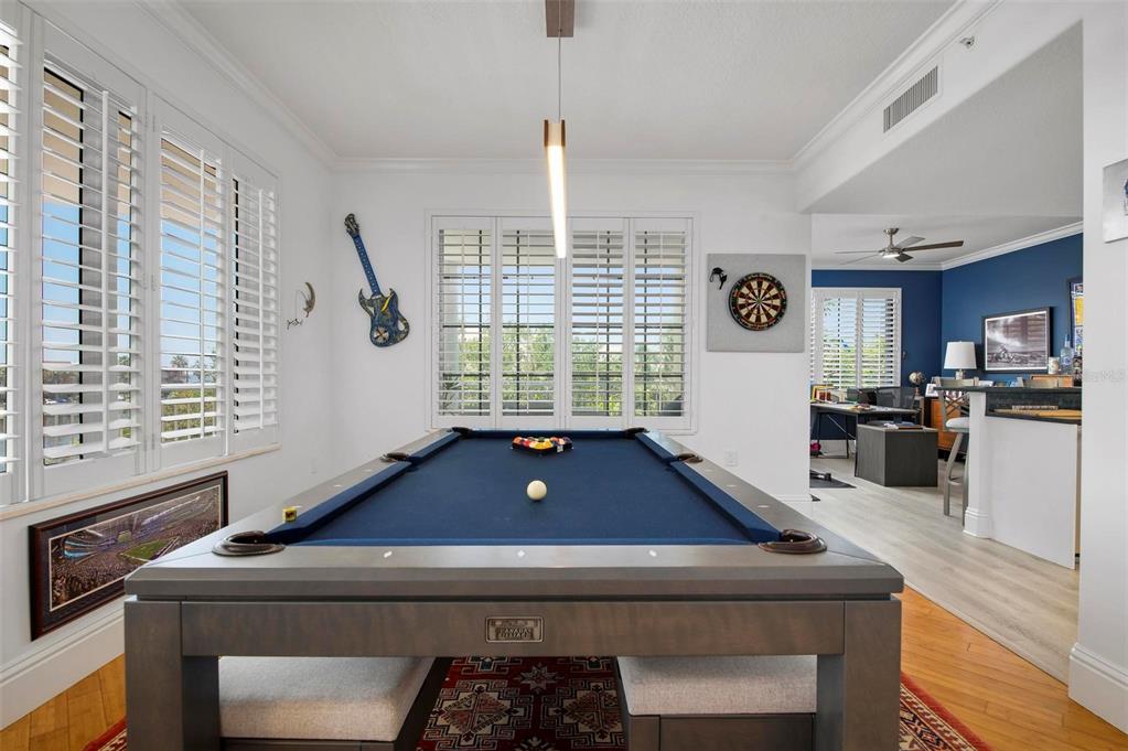 9122 Midnight Pass Road, Unit 34 Sarasota, FL 34242 - Photo 10 of 61 a living room with a bed furniture and a window