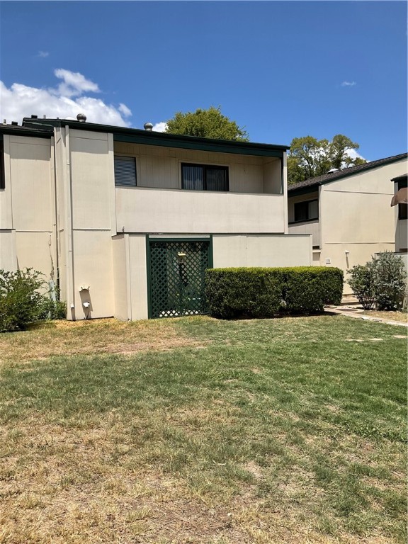 6718 Silvermine Drive, Unit 704 Austin, TX 78736 - Photo 2 of 20 a front view of a house with a yard