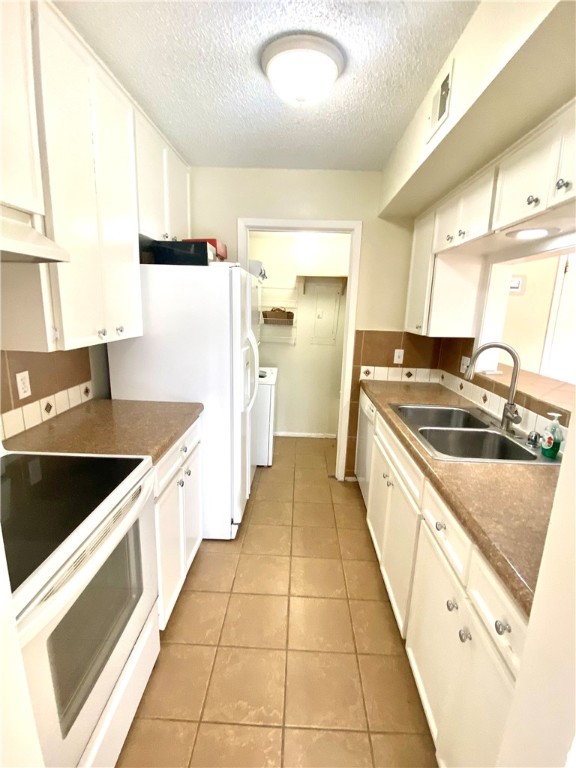 6718 Silvermine Drive, Unit 704 Austin, TX 78736 - Photo 3 of 20 a kitchen with stainless steel appliances granite countertop a sink stove and refrigerator