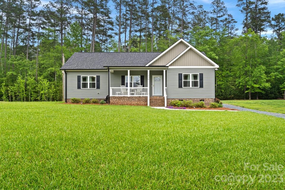 330 Manchester Road Mount Gilead, NC 27306 - Photo 1 of 30 a front view of house with yard and green space