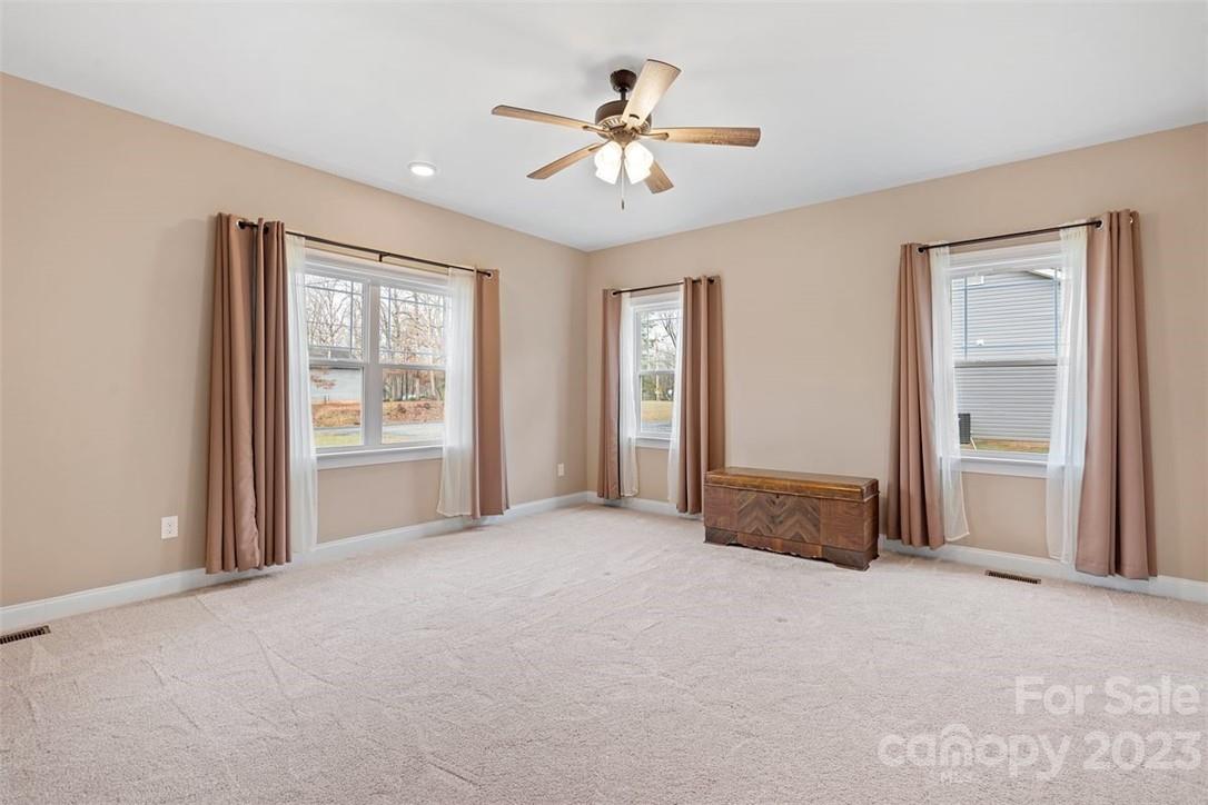 330 Manchester Road Mount Gilead, NC 27306 - Photo 15 of 30 an empty room with closet and a ceiling fan