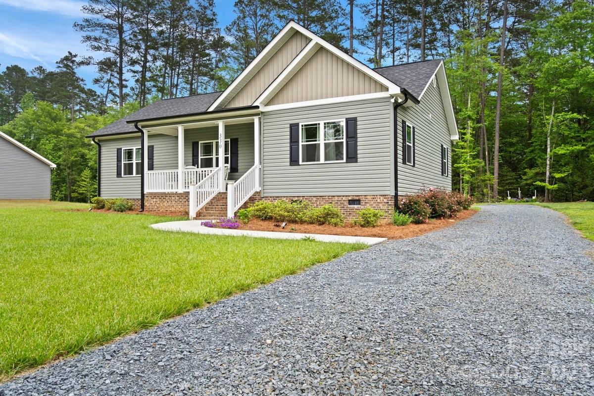 330 Manchester Road Mount Gilead, NC 27306 - Photo 2 of 30 a front view of house with yard and green space