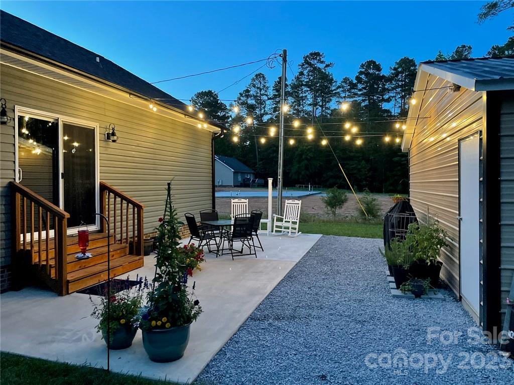 330 Manchester Road Mount Gilead, NC 27306 - Photo 23 of 30 a view of a chairs and tables in the patio