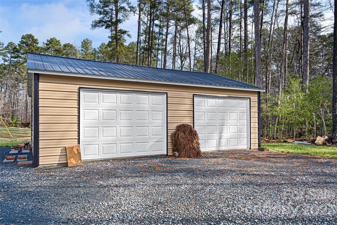 330 Manchester Road Mount Gilead, NC 27306 - Photo 24 of 30 a front view of a house with a yard