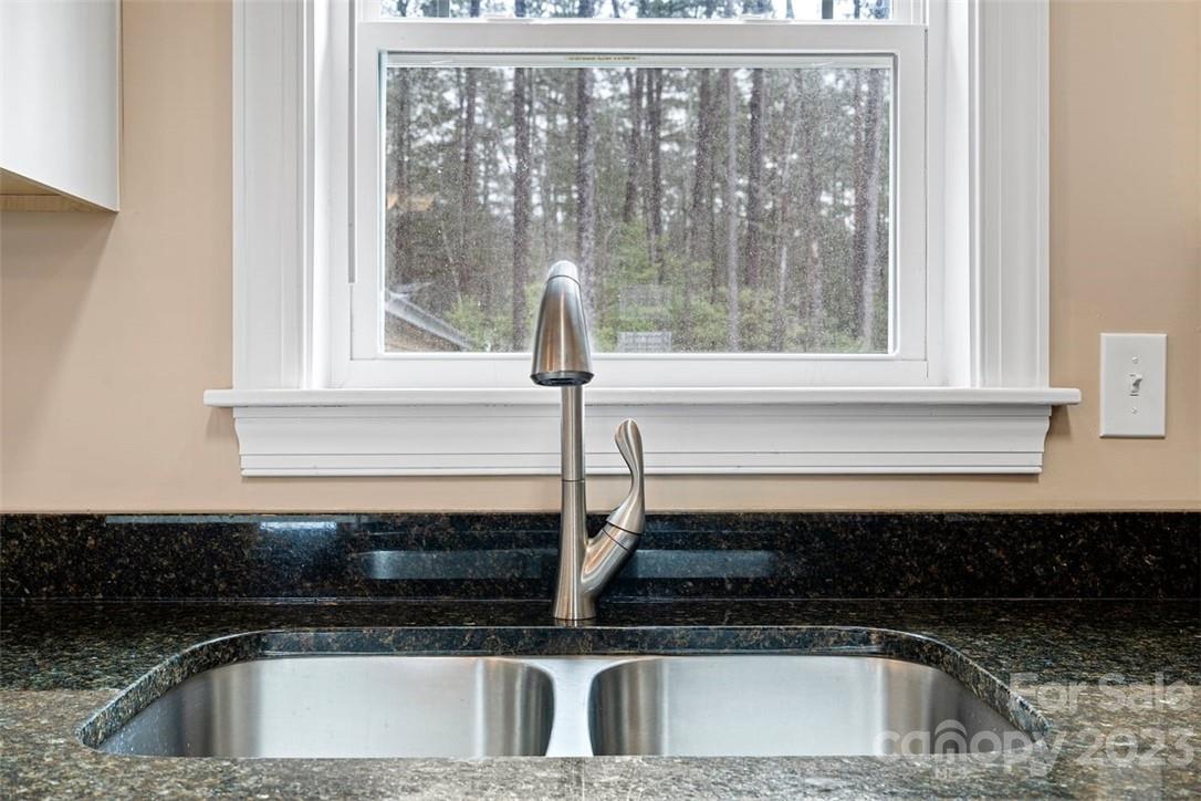 330 Manchester Road Mount Gilead, NC 27306 - Photo 10 of 30 a kitchen with a sink and cabinets
