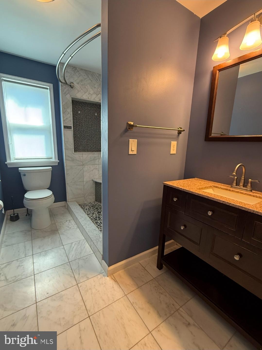 21 East Avenue, Unit B Woodstown, NJ 08098 - Photo 6 of 10 a bathroom with a sink and a mirror