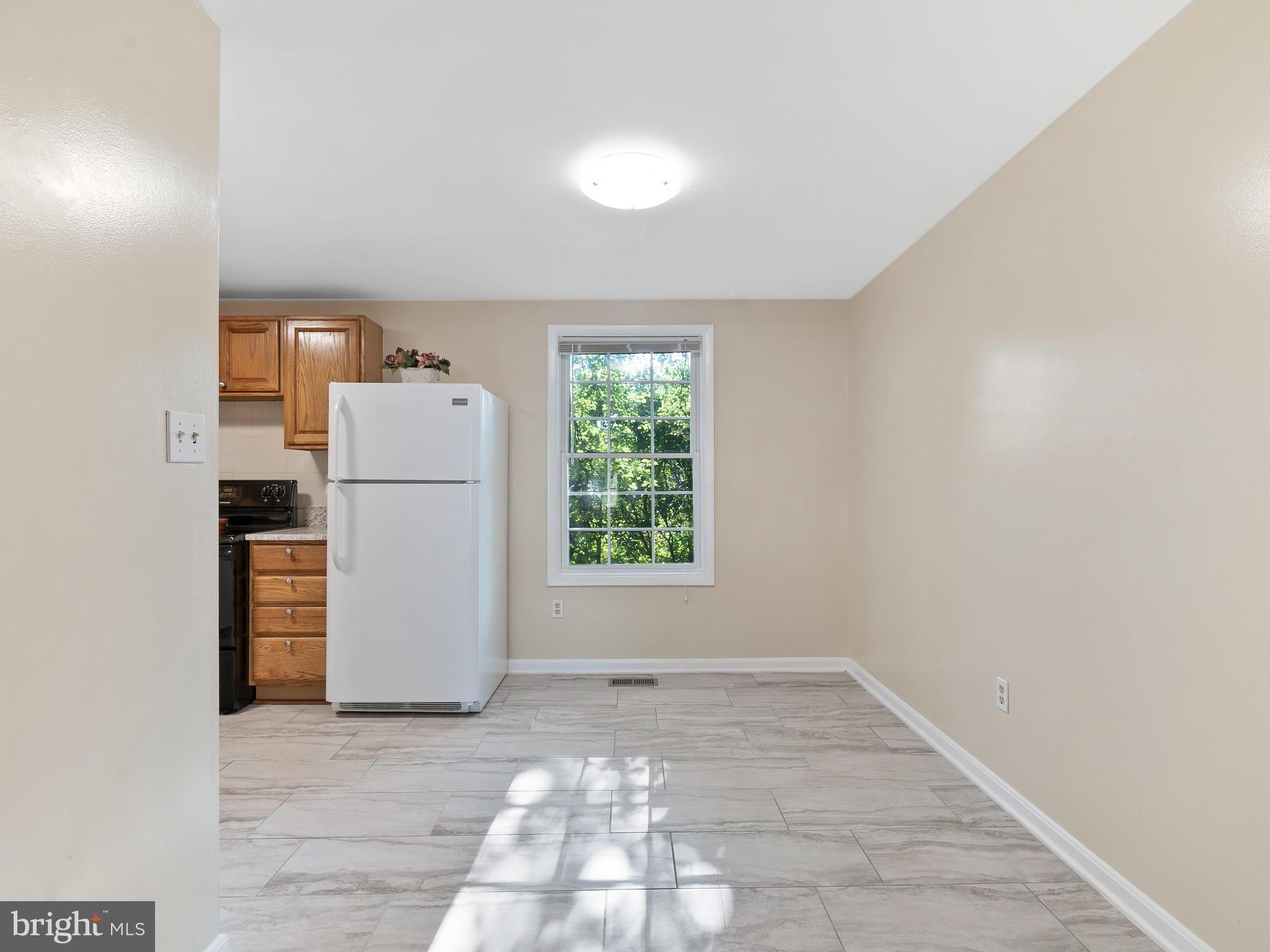19044 Staleybridge Road Germantown, MD 20876 - Photo 12 of 30 a view of a storage & utility room with a window