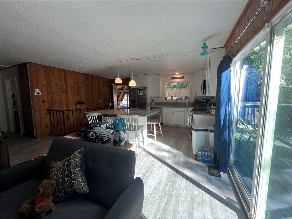 23857 Zuger Drive Crestline, CA 92325 - Photo 12 of 29 a living room with furniture and a fireplace