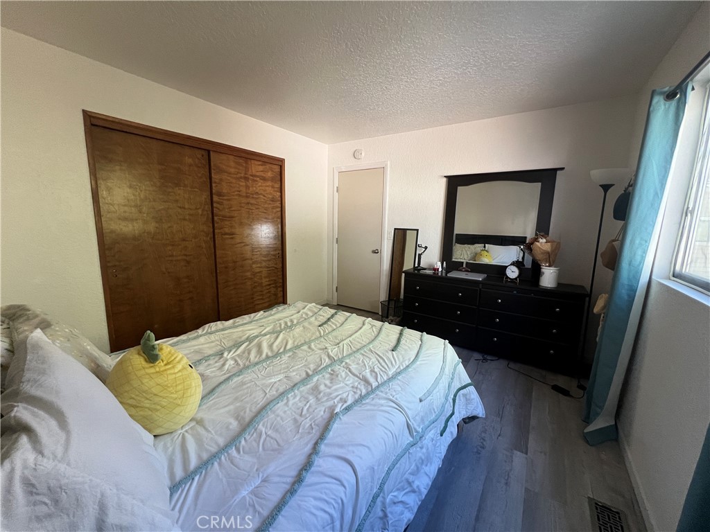 23857 Zuger Drive Crestline, CA 92325 - Photo 15 of 29 a bedroom with a bed and a dresser