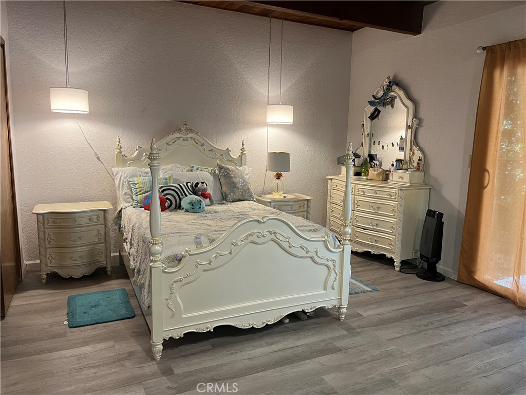 23857 Zuger Drive Crestline, CA 92325 - Photo 18 of 29 a bedroom with a bed and cabinets