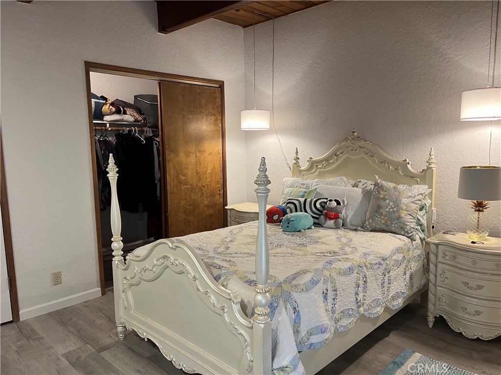 23857 Zuger Drive Crestline, CA 92325 - Photo 19 of 29 a bedroom with a bed and a mirror