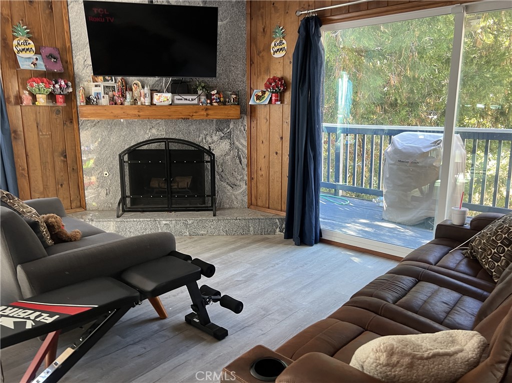 23857 Zuger Drive Crestline, CA 92325 - Photo 6 of 29 a living room with furniture and a fireplace