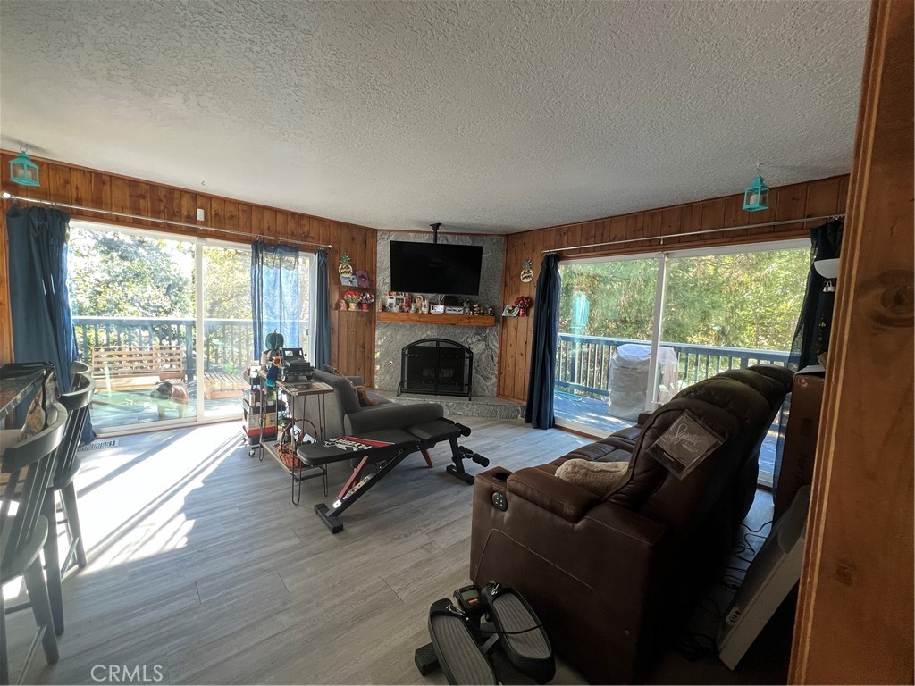 23857 Zuger Drive Crestline, CA 92325 - Photo 8 of 29 a living room with furniture tv and a large window
