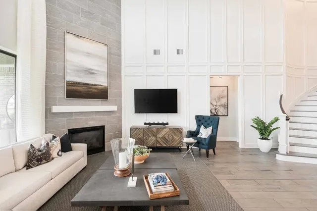 a living room with furniture and a fireplace