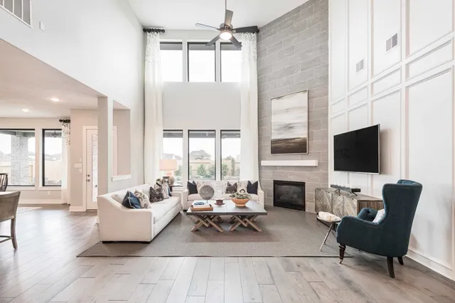 a living room with furniture fireplace and a flat screen tv