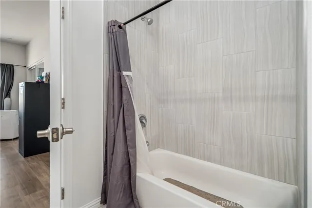 a bathroom with a bathtub and a shower