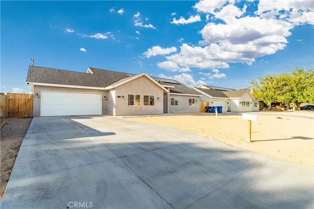 a view of house with yard and entertaining space