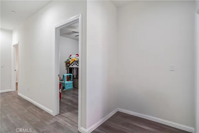 a room that has a hallway and wooden floor