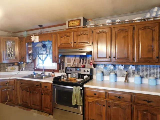 a kitchen with a table and chairs