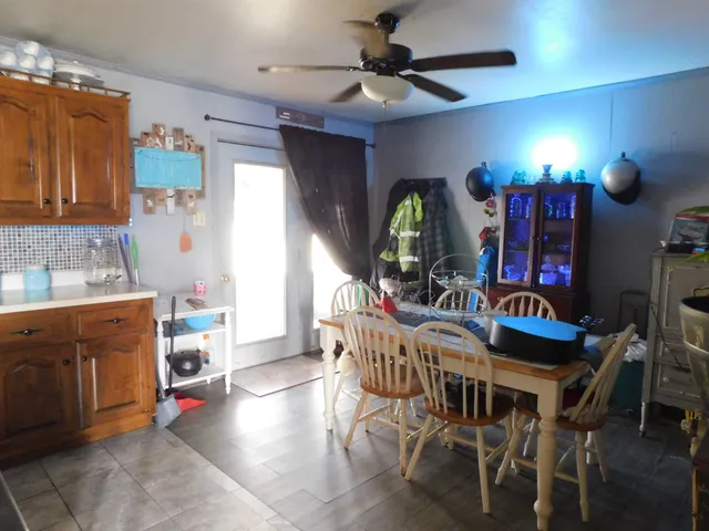a living room filled with furniture and a chandelier